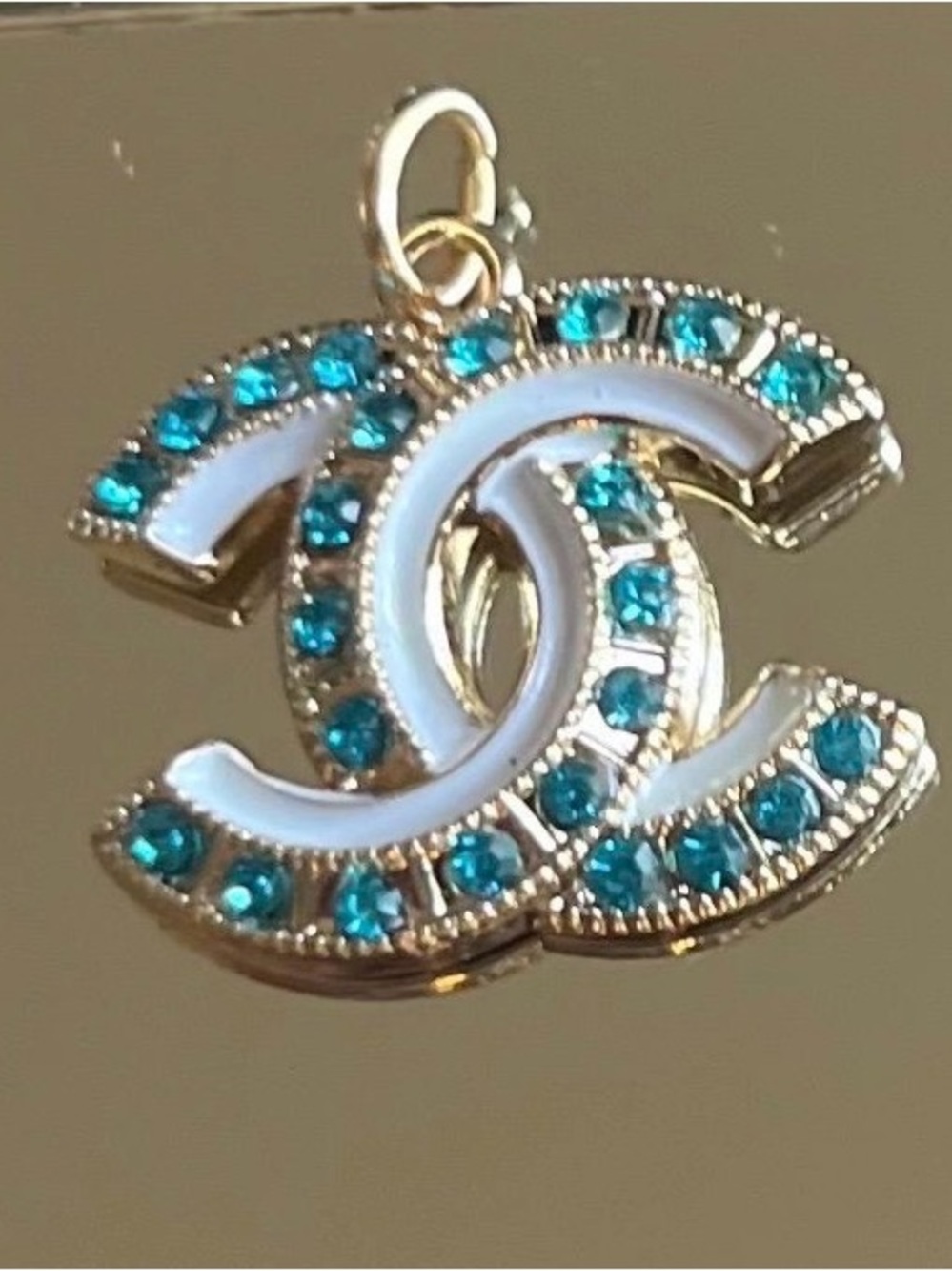 CHANEL Gold Double C Pendant with Teal Crystals and White Enamel